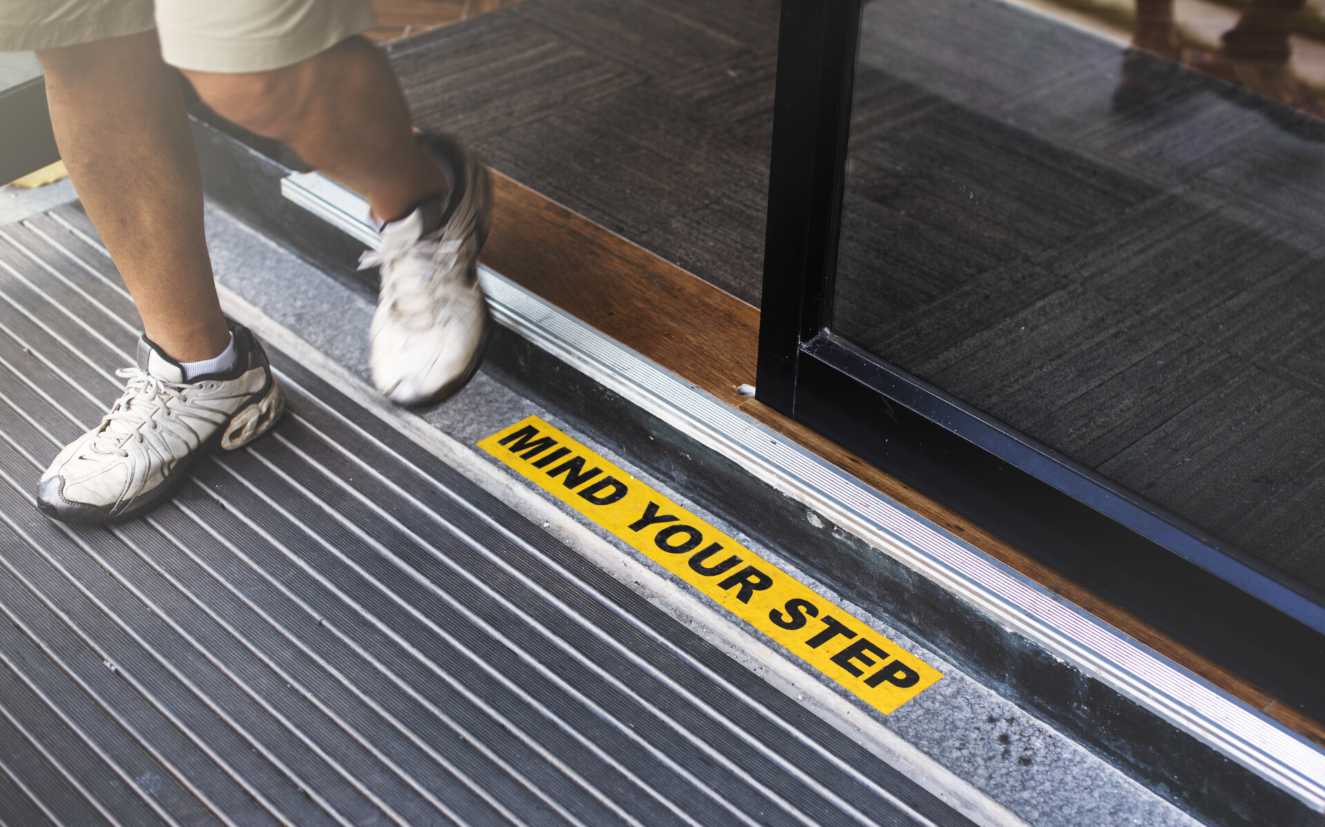 wet floor slip hazard warning sign shopping centre