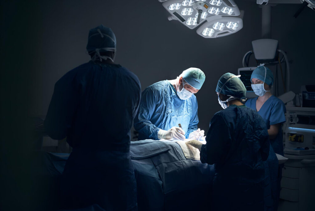 Wolf Law are the number one accident solicitors in Liverpool and the Wirral, supporting claims for personal injury claims in Liverpool Wolf Law are the number one accident solicitors in Liverpool and the Wirral, supporting claims for personal injury claims in Liverpool Surgeons in blue scrubs and masks perform surgery under bright overhead lights around a patient on the operating table.