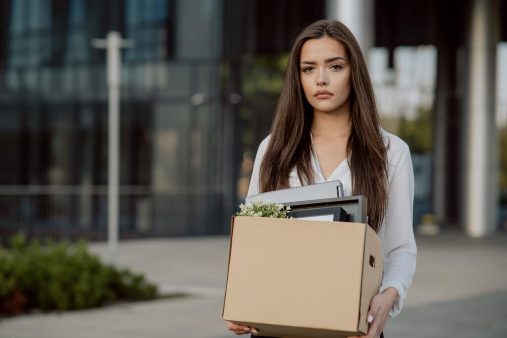 Wolf Law are the number one accident solicitors in Liverpool and the Wirral, supporting claims for personal injury claims in Liverpool Wolf Law are the number one accident solicitors in Liverpool and the Wirral, supporting claims for personal injury claims in Liverpool Young woman in a white blouse outside an office, carrying a cardboard box and a stack of folders/files.