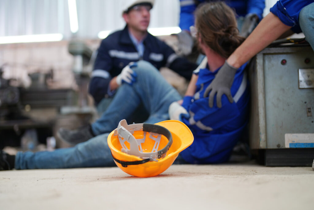 Wolf Law - The Top Accident Solicitors In Liverpool Wolf Law Wolf Law - The Top Accident Solicitors In Liverpool Wolf Law Worker receiving industrial injury in factory Wolf Law are the number one accident solicitors in Liverpool and the Wirral, supporting claims for personal injury claims in Liverpool Wolf Law are the number one accident solicitors in Liverpool and the Wirral, supporting claims for personal injury claims in Liverpool Orange safety helmet on the floor in the foreground, with two workers resting and talking in a blue-workwear shop in the blurred background.